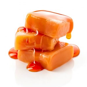 Three Caramel Candies Stacked with Melted Dripping Caramel